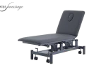 Medical treatment table with hydraulic lift